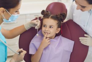 Child receiving friendly pediatric dental care during a children’s dentistry visit