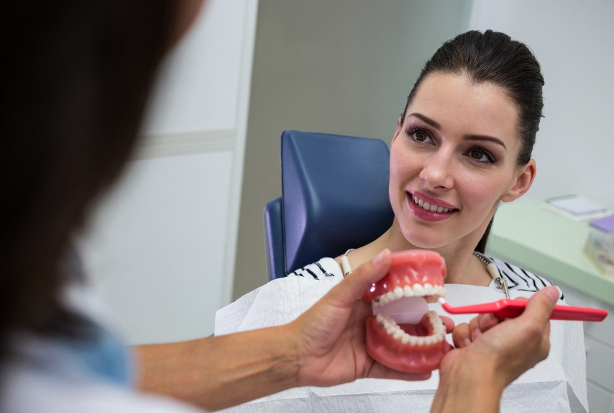 Dentist performing full mouth rehabilitation for complete dental restoration