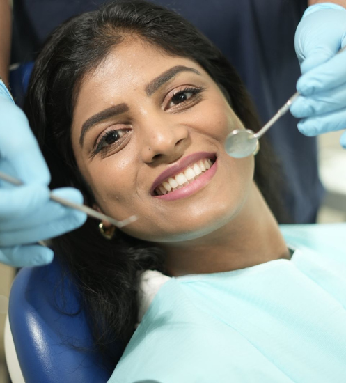 Female patient smiling during smile design consultation at dental clinic